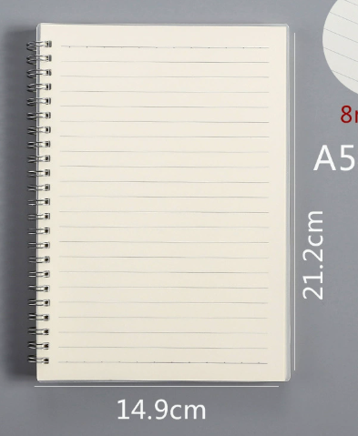 Sassy in our 40s coil bound notebook with a pen tucked into the coils, illustrating convenient storage for student supplies.